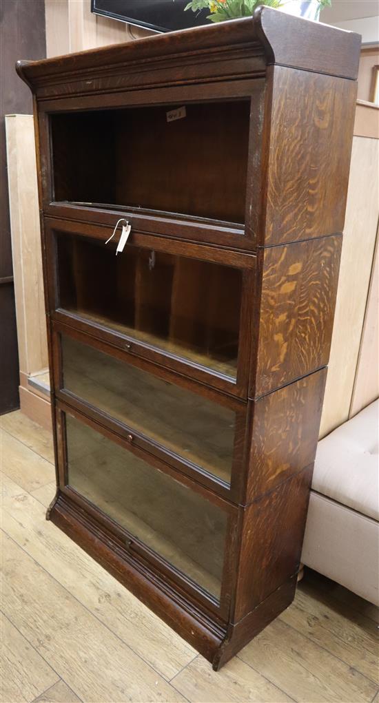 A Globe Wernicke style oak four section bookcase W.86cm